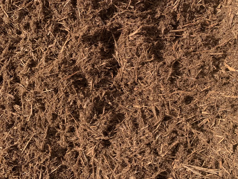 Double-grind cedar mulch texture sold by the cubic yard in Burnet, Texas